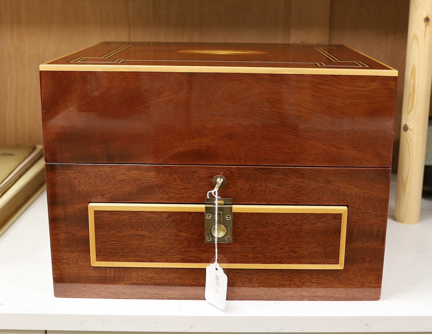 An inlaid travelling decanter box, with lower drawer and a set of Royal Doulton glasses